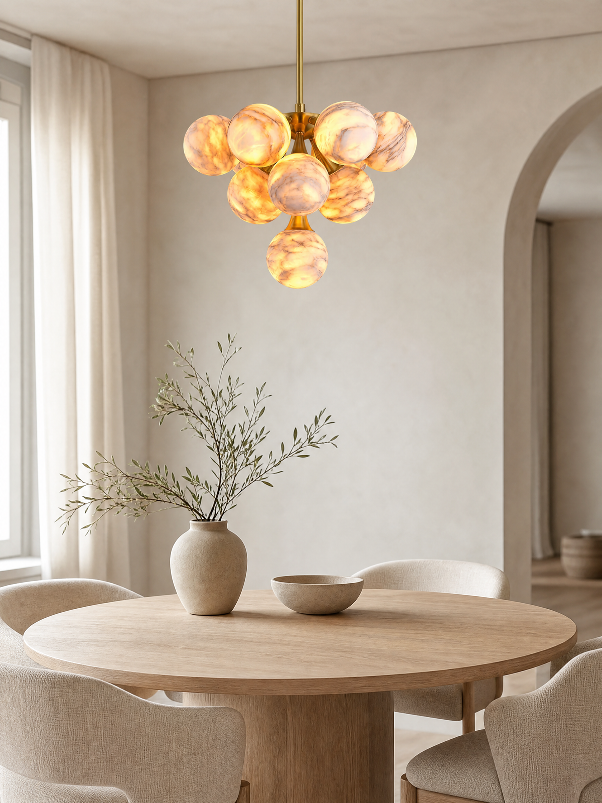 Alabaster chandelier above a round oak dining table