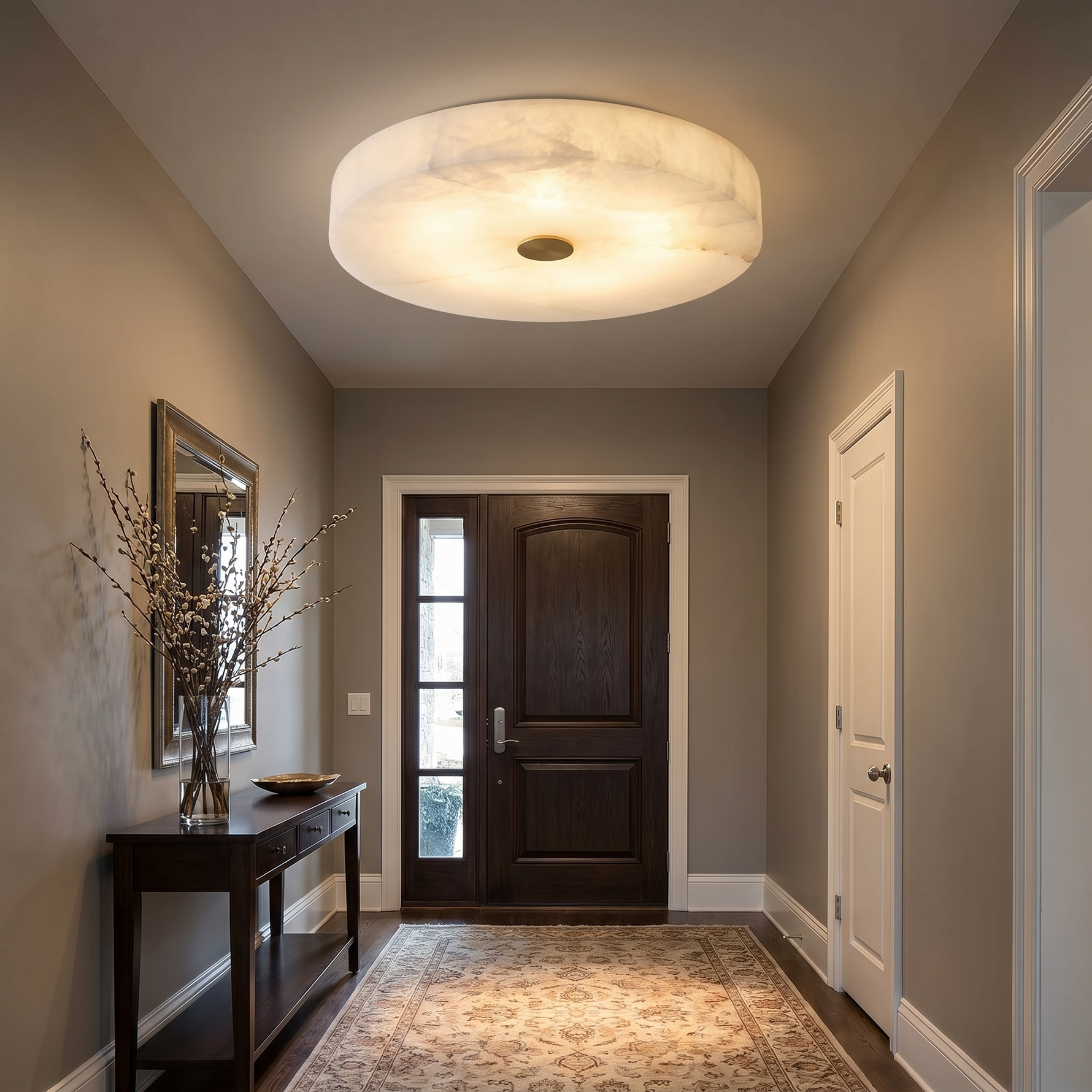 Modern entryway alabaster ceiling light installed on white ceiling — Orbita flush mount