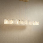 Yiosi 63" linear glass chandelier with handmade textured glass panels and champagne gold canopy — modern dining pendant