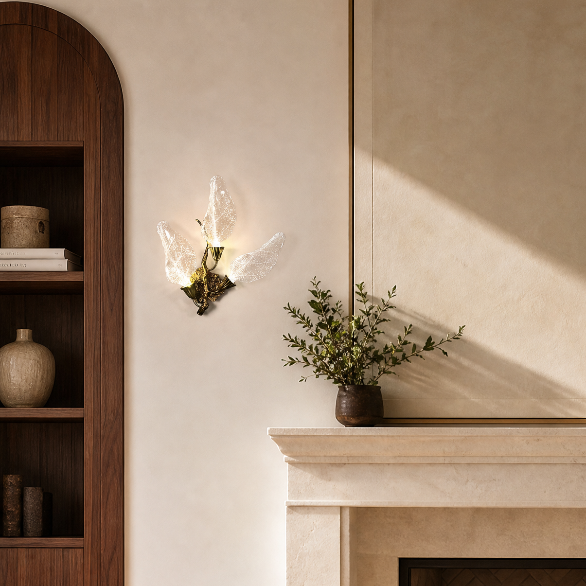 A wall sconce featuring sculpted leaf-shaped textured glass shades and a warm gold metal finish.