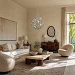 A spherical pendant light with a polished chrome lattice frame and clear crystal droplets hanging inside.