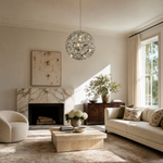A spherical pendant light with a polished chrome lattice frame and clear crystal droplets hanging inside.