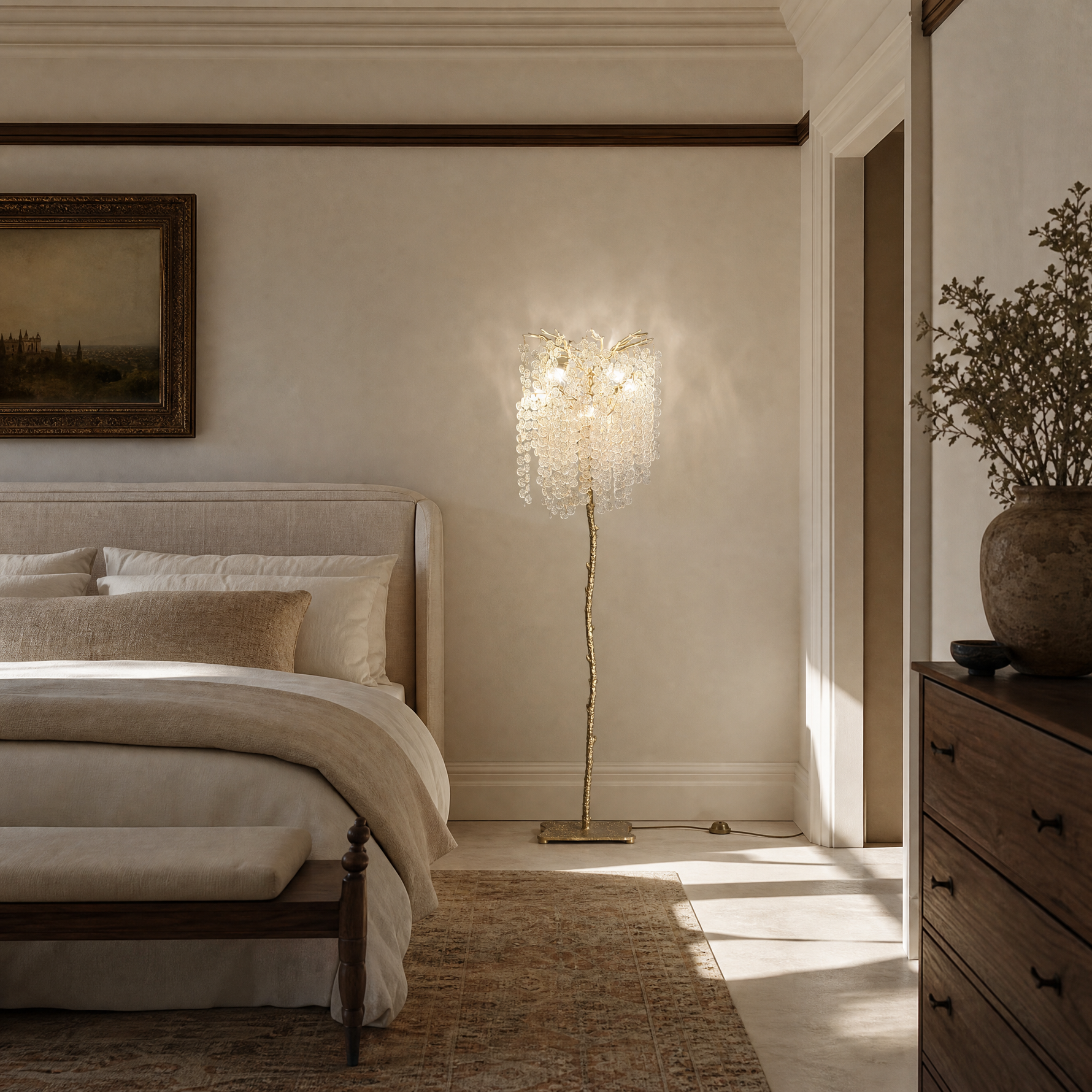 A gold metal tree floor lamp with cascading clear crystal drops standing on a square brass base.
