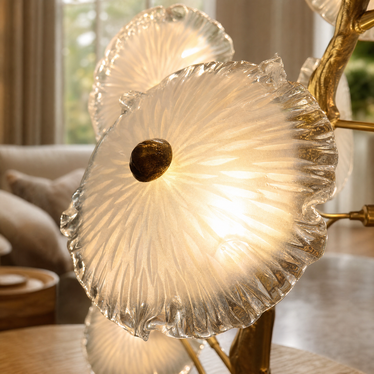 A Yiosi floor lamp with a gold brass organic branch stem and clear fluted glass flower petal shades.
