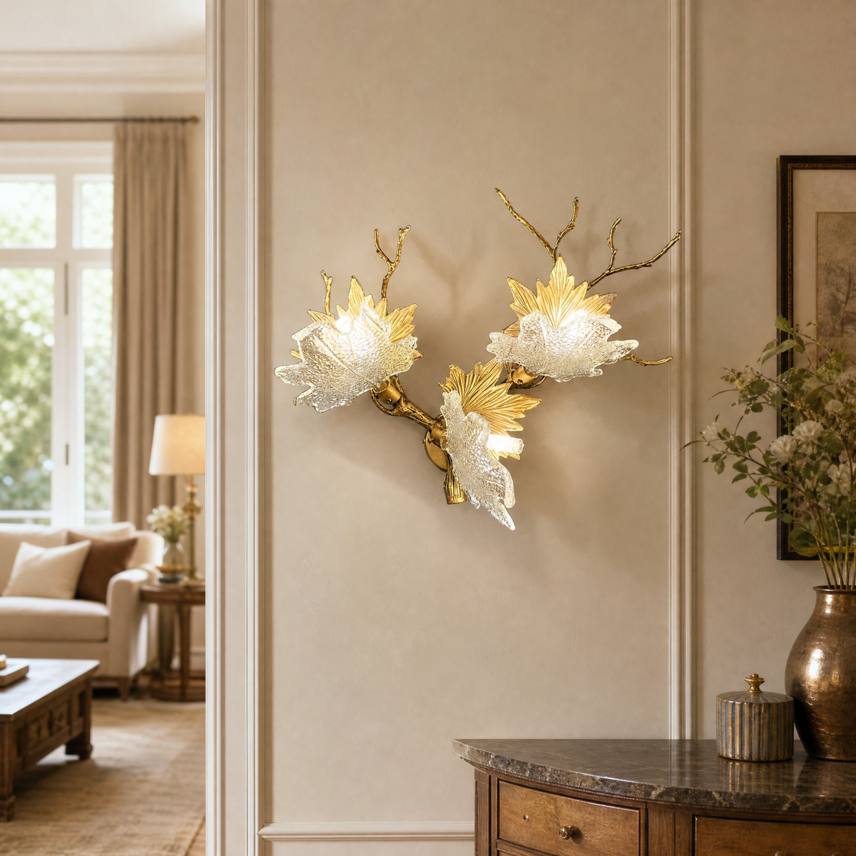 A Yiosi gold metal wall sconce featuring a maple branch design with three floral glass petal shades for ambient lighting.