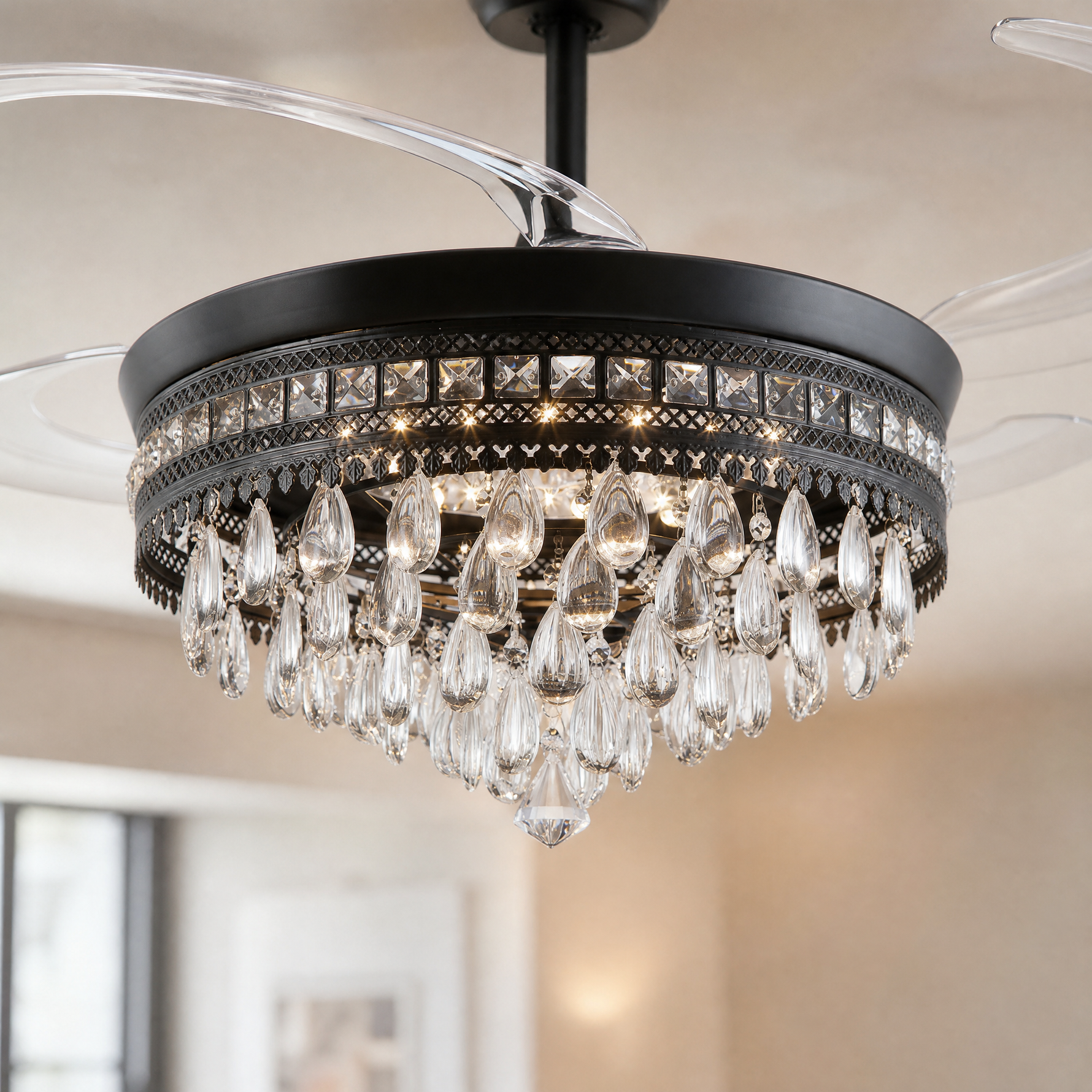 A matte black drum frame ceiling fan with cascading crystals and retractable clear acrylic blades.