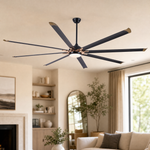 A modern eight-blade industrial ceiling fan with a matte black and rose gold finish featuring a center frosted LED light