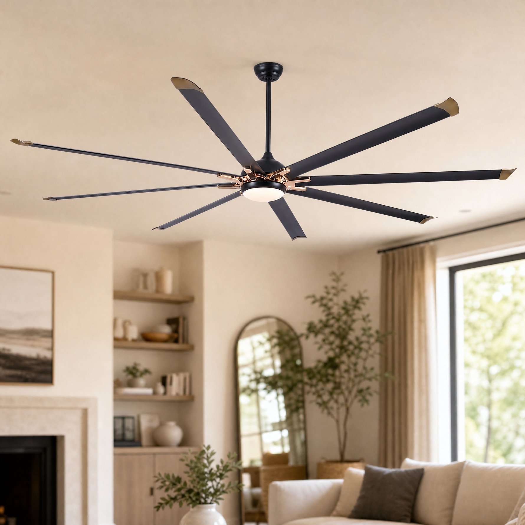 A modern eight-blade industrial ceiling fan with a matte black and rose gold finish featuring a center frosted LED light