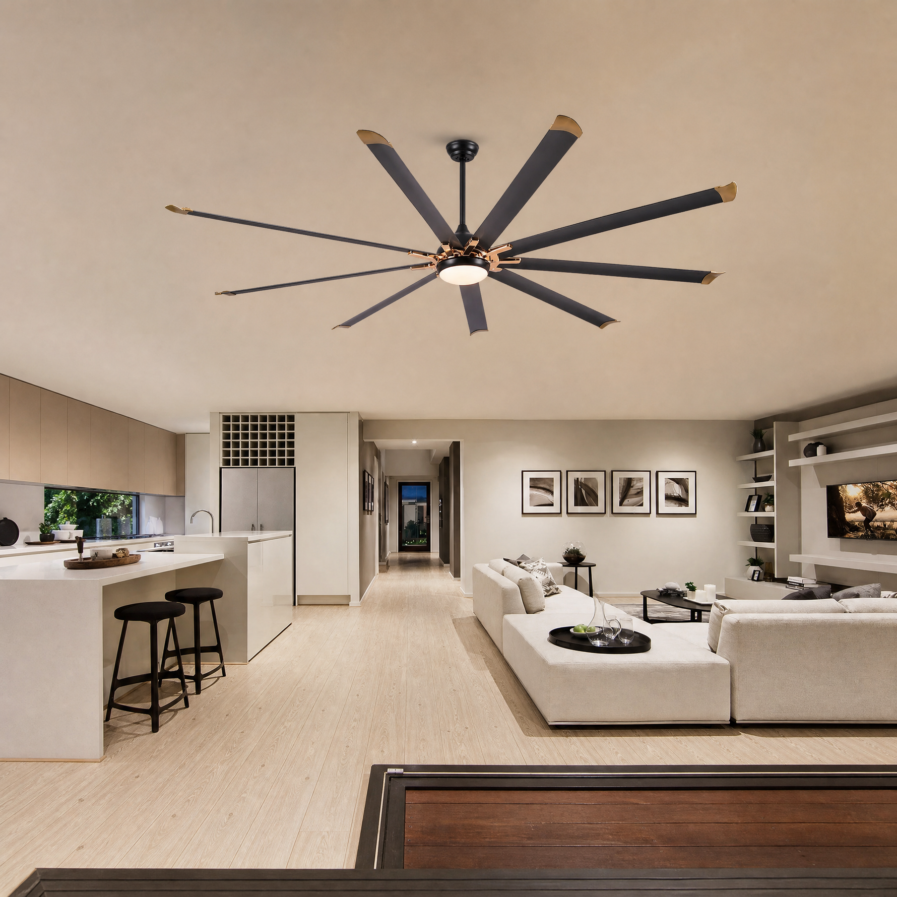 A modern eight-blade industrial ceiling fan with a matte black and rose gold finish featuring a center frosted LED light