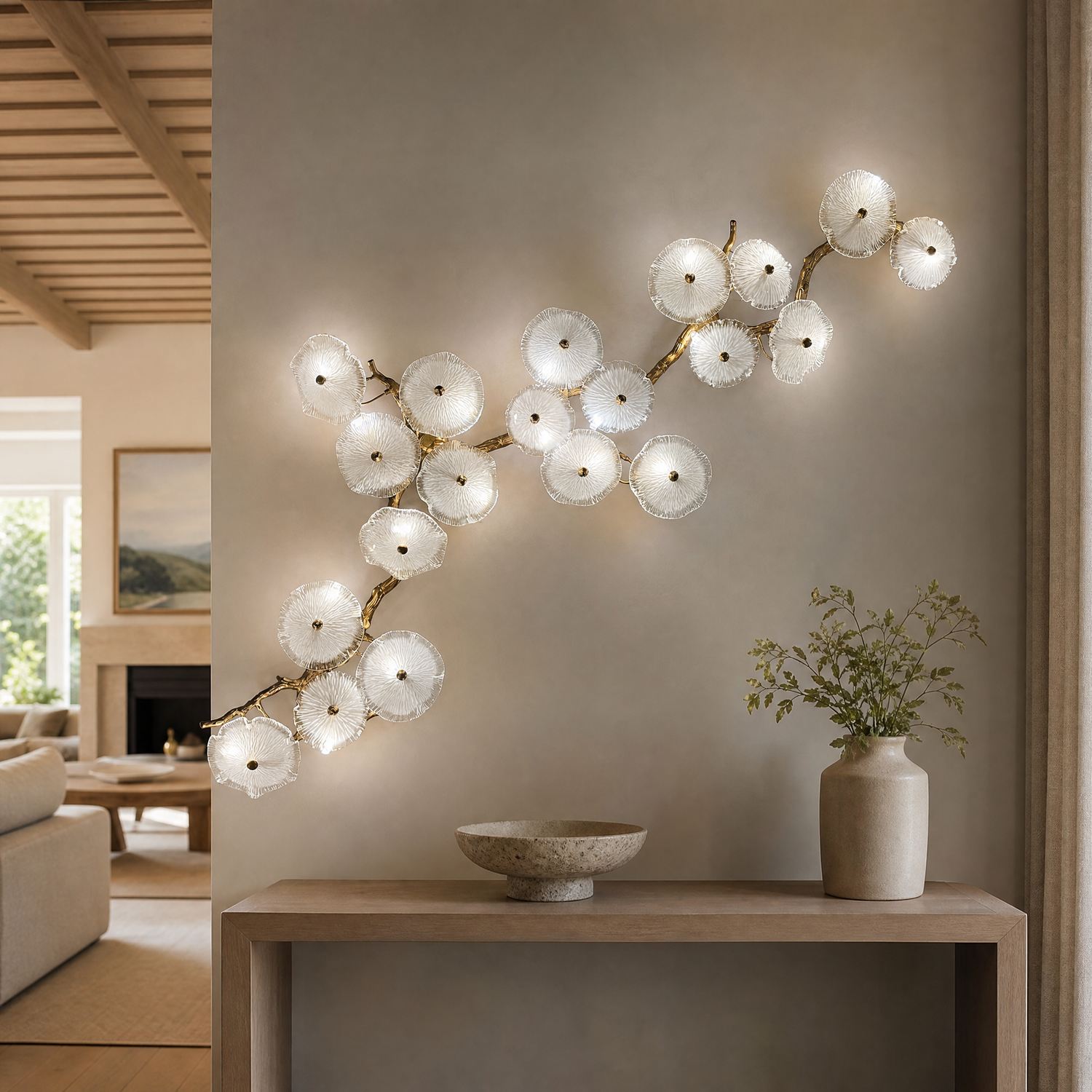 A modern wall sconce featuring an antique brass branch-like metal frame adorned with textured circular glass blossom shades.