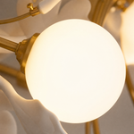 Thalia Ginkgo Leaf Chandelier with White Glass Globes and Ceramic Leaves