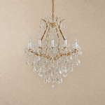 Maria Theresa Gold Chandelier in a bedroom