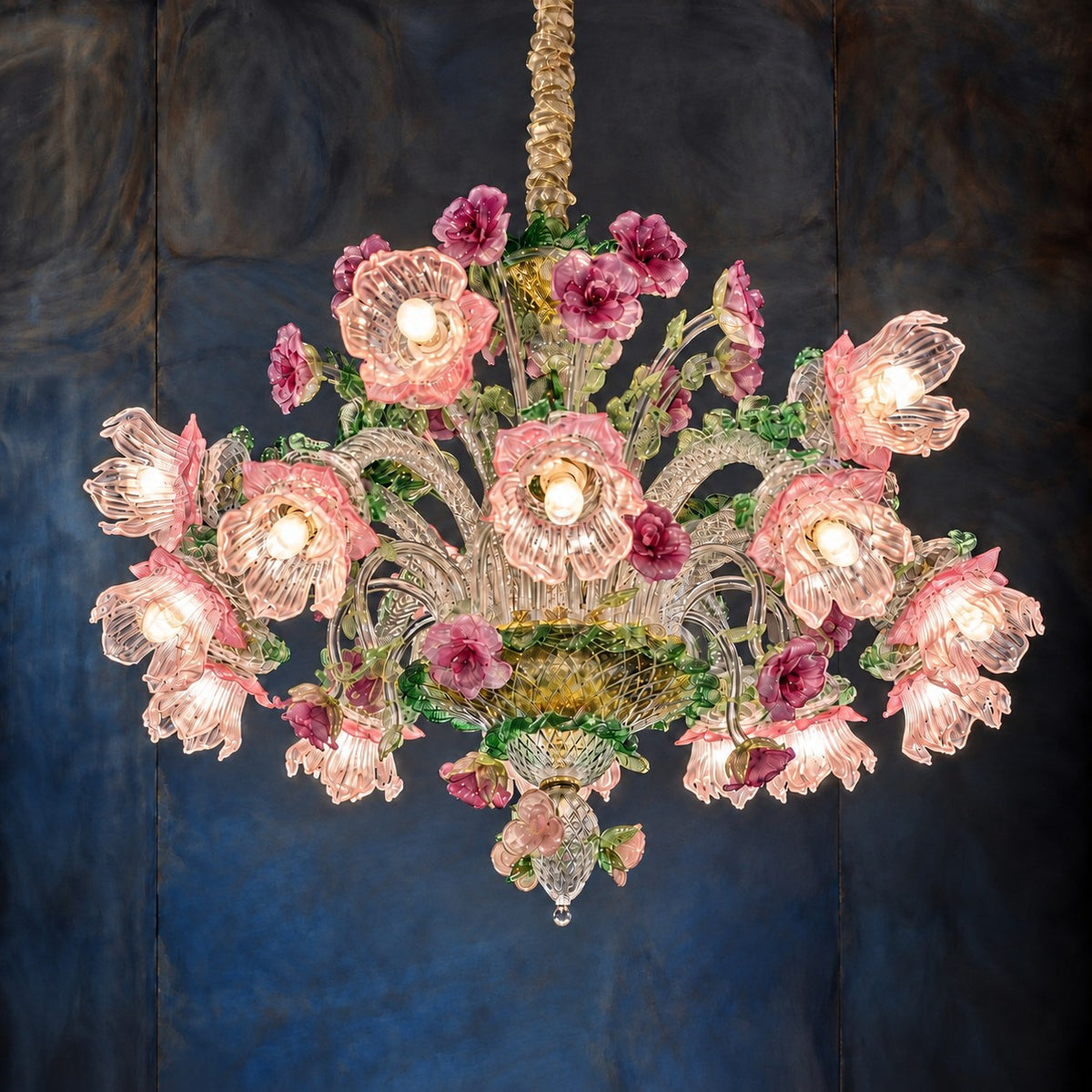 Amorena Pink Floral Glass 15-Light Chandelier 37.4" on a dark blue-grey wall