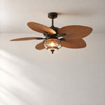 Bronze Palm Leaf Ceiling Fan with Caged Seeded Glass Light – lights on