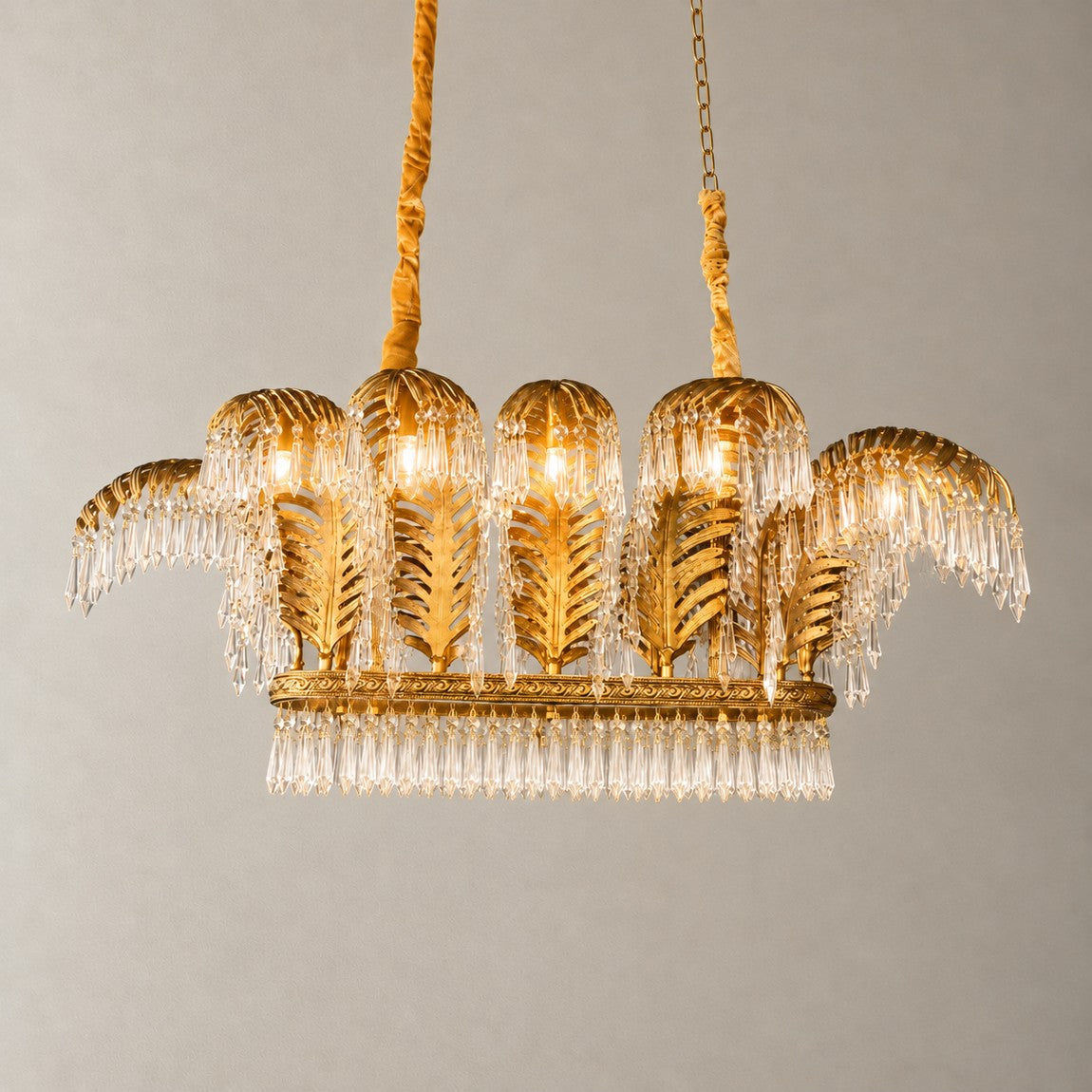 Crystal Chandelier Art Deco Textured Gold Metal 8-Light 59.1" L for Dining Room on a light warm plaster wall