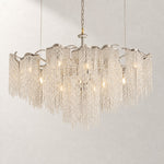 Crystal Chandelier Chrome Metal Crystal 15-Light 59.1" L for Dining Room on a light warm plaster wall