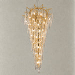 Crystal Chandelier Modern Gold Branch Metal 26-Light for Dining Room on a light warm plaster wall