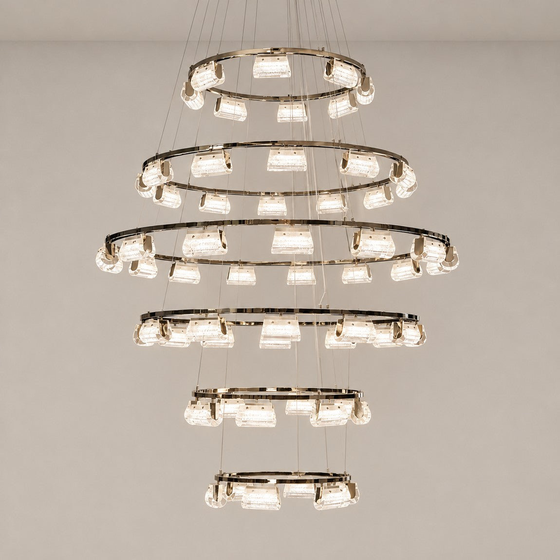 Crystal Chandelier Modern Light Gold Metal K5 Crystal for Dining Room on a light warm plaster wall