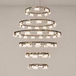 Crystal Chandelier Modern Light Gold Metal K5 Crystal for Dining Room on a light warm plaster wall