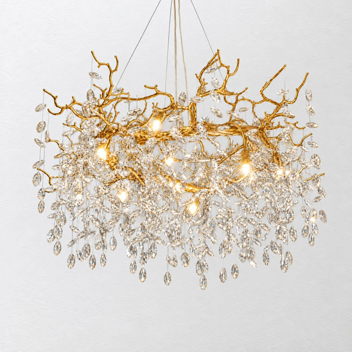 Crystal Chandelier Modern Textured Gold Metal 15-Light Ø47.2" for Living Room on a light warm plaster wall