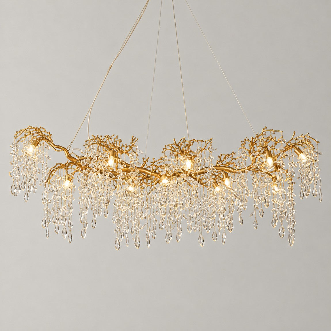 Crystal Chandelier Organic Modern Gold Metal 18-Light 70.9"L for Dining Room on a light warm plaster wall