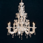 Elvora White Tiered Glass 9-Light Chandelier 49.6" on a deep teal-blue wall