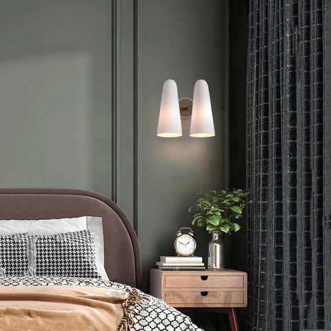 wall sconce next to bed	