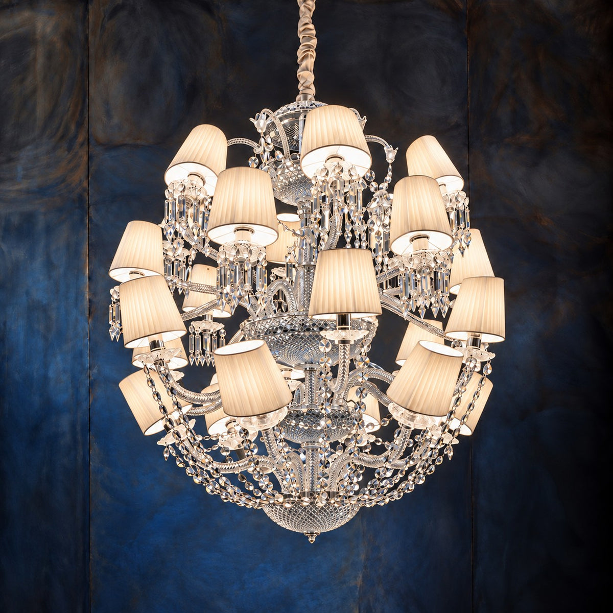 Gavolta White Domed Crystal 24-Light Chandelier 39.4" on a dark blue-grey wall
