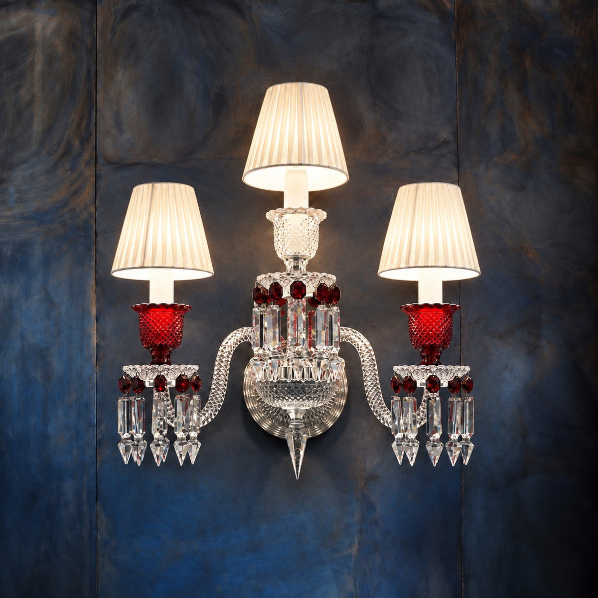 Grenata Red Pleated Crystal 3-Light Wall Sconce 19.7" on a dark blue-grey wall