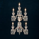 Havrelle Tiered Candle Crystal 7-Light Wall Sconce 20.5" on a deep teal-blue wall
