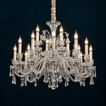 Lavessi Clear Candle Crystal 18-Light Chandelier 37" on a deep teal-blue wall