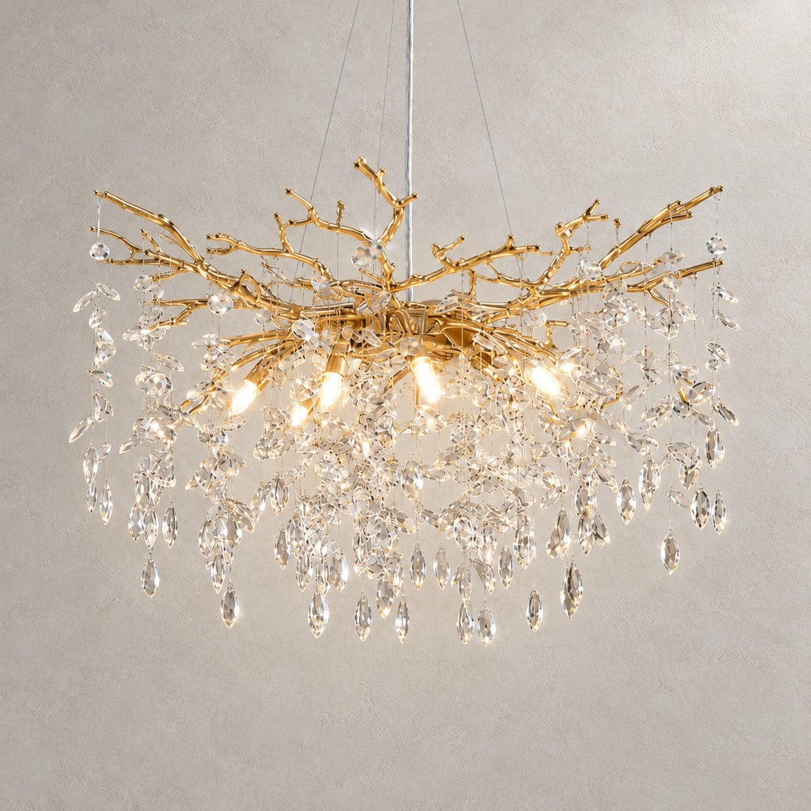 Marquise Round Pendant 760 - Gold (New Color) on a light warm plaster wall