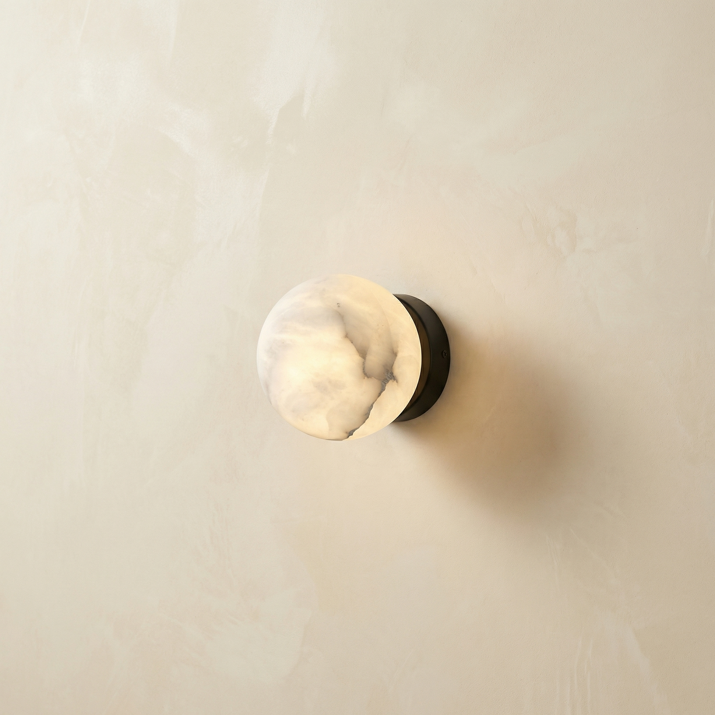 Yiosi Luna Disc Compact Orb Alabaster Black Wall Sconce - Image 1