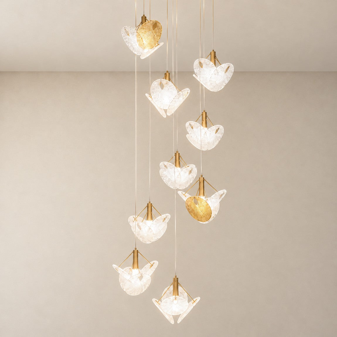 Modern Chandelier Deep Gold Metal Glass Rhinestone 9-Light for Staircase on a light warm plaster wall