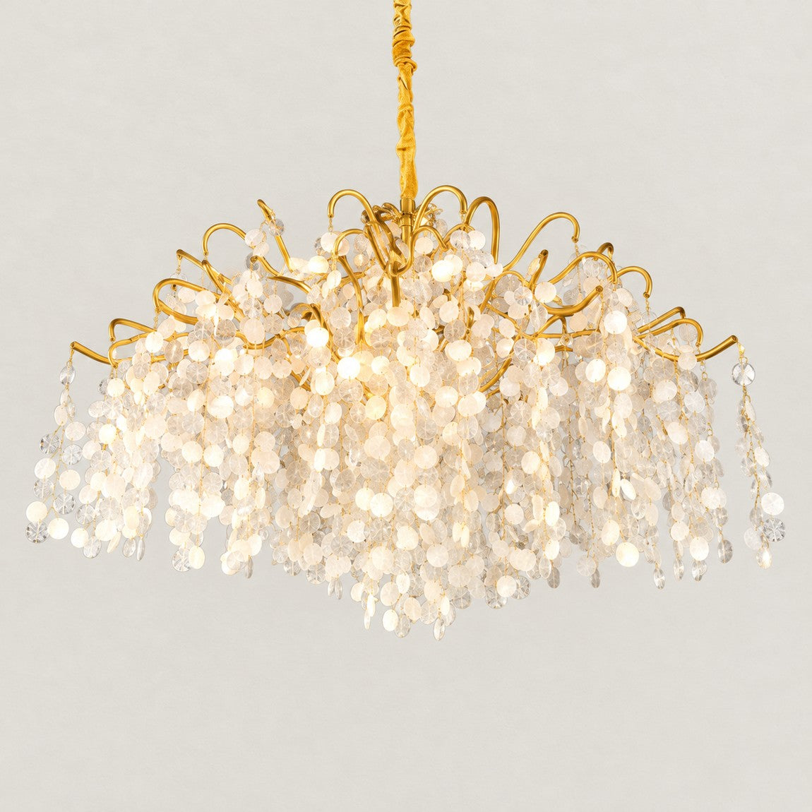 Modern Chandelier Gold Capiz Shell 18-Light Ø47.2" × 25.6"H for Living Room on a light warm plaster wall