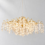 Modern Chandelier Gold Cascading Glass Discs 18-Light 59.1"L for Dining Room on a light warm plaster wall
