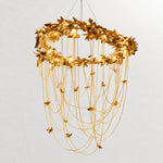Modern Chandelier Gold Metal Leaf and Chain 12-Light Ø63.0" for Dining Room on a light warm plaster wall