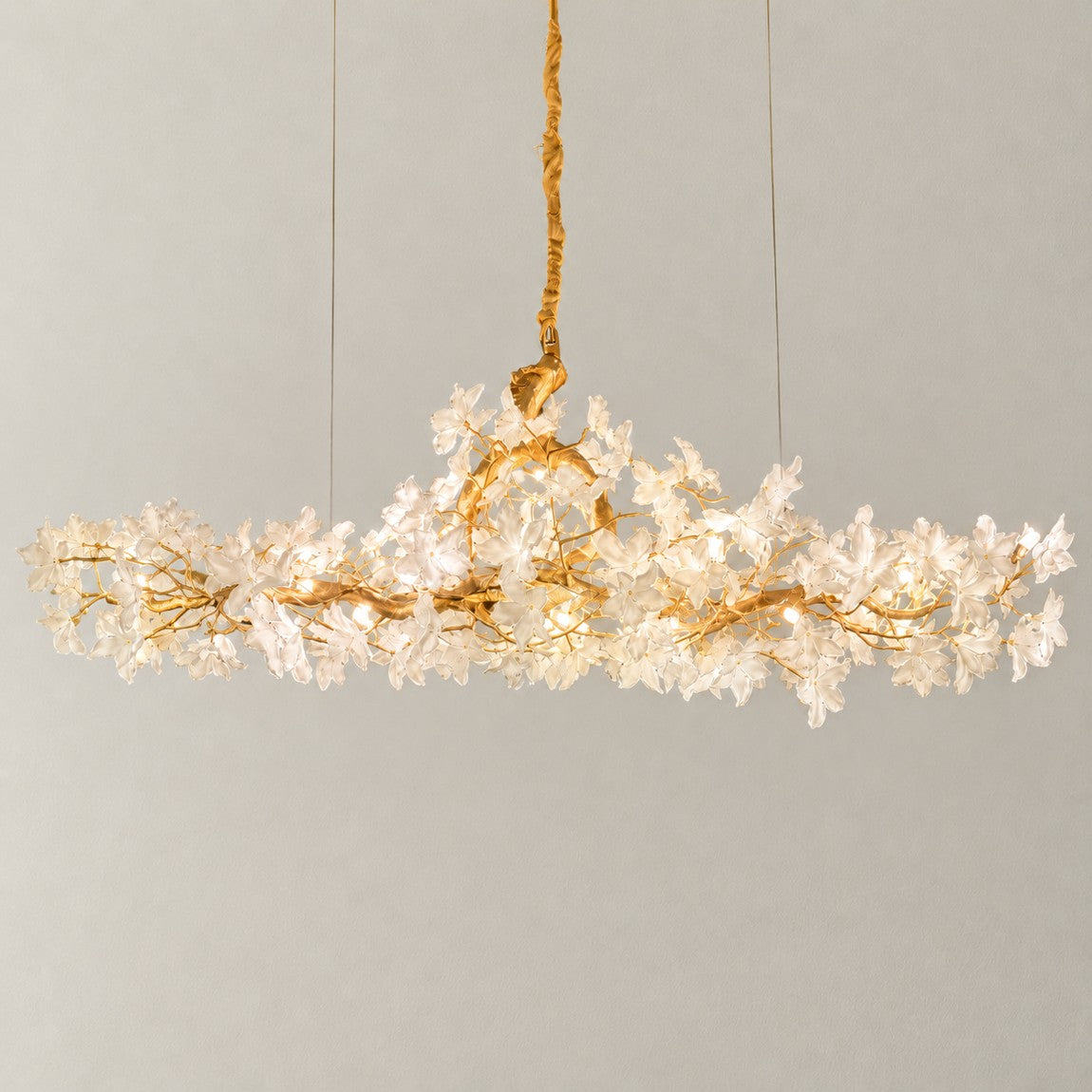 Modern Chandelier Gold Metal White Glass Flower 20-Light 78.7"L for Dining Room on a light warm plaster wall