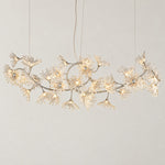Modern Chandelier Polished Chrome Clear Glass 38-Light 102.4"L for Dining Room on a light warm plaster wall