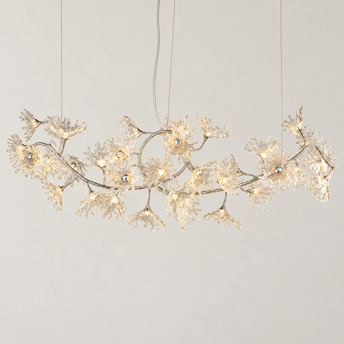Modern Chandelier Polished Chrome Clear Glass 38-Light 102.4"L for Dining Room on a light warm plaster wall