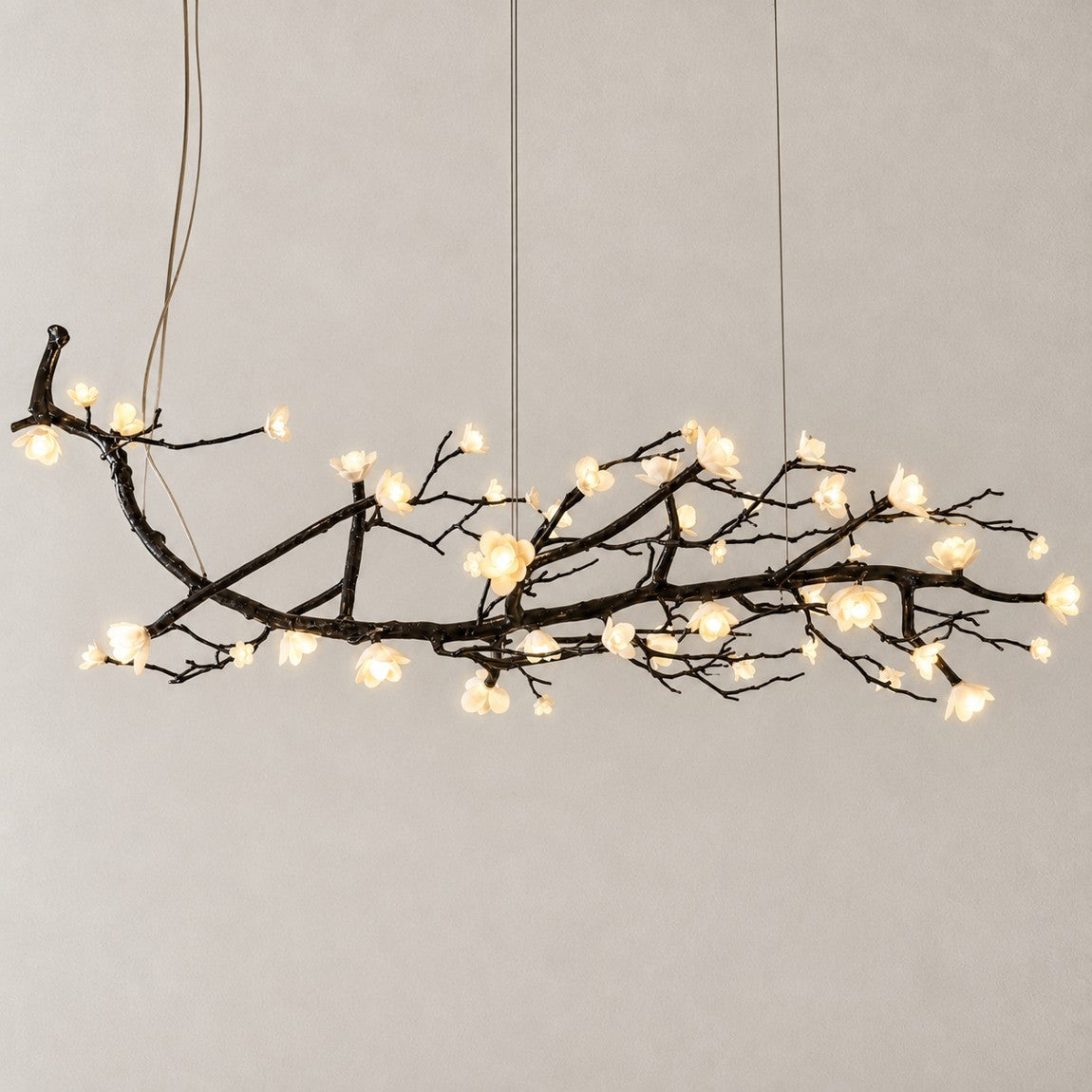 Modern Chandelier Textured Black Metal White Ceramic Flower for Dining Room on a light warm plaster wall