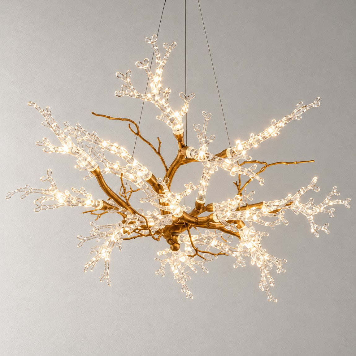 Modern Chandelier Textured Gold Glass Branch 22-Light for Dining Room on a light warm plaster wall