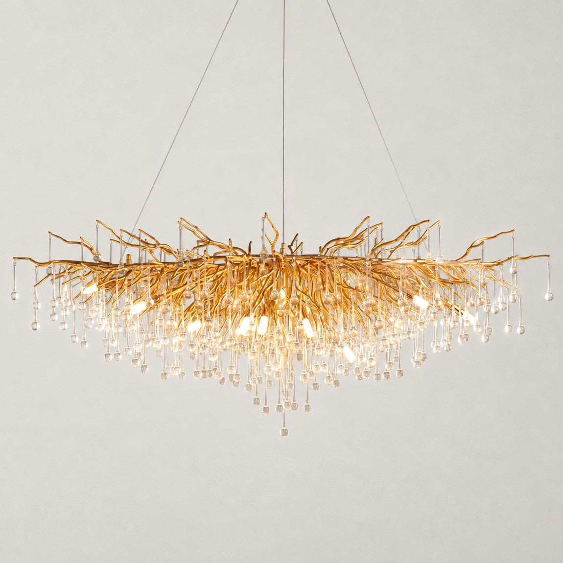 Modern Crystal Tree Branch Chandelier 15 Lights on a light warm plaster wall