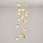 Modern Pendant Light Deep Gold ADC12 Aluminium Alloy and Glass for Dining Room on a light warm plaster wall