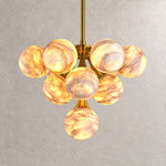 Modern Round Alabaster Chandelier on a light warm plaster wall