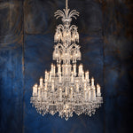 Nolva Chrome Tiered Crystal 73-Light Chandelier 59.1" on a dark blue-grey wall