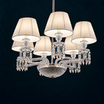 Ombria White Pleated Crystal 6-Light Chandelier 28.3" on a deep teal-blue wall