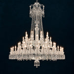 Solvanne Clear Tiered Crystal 64-Light Chandelier 63" on a deep teal-blue wall