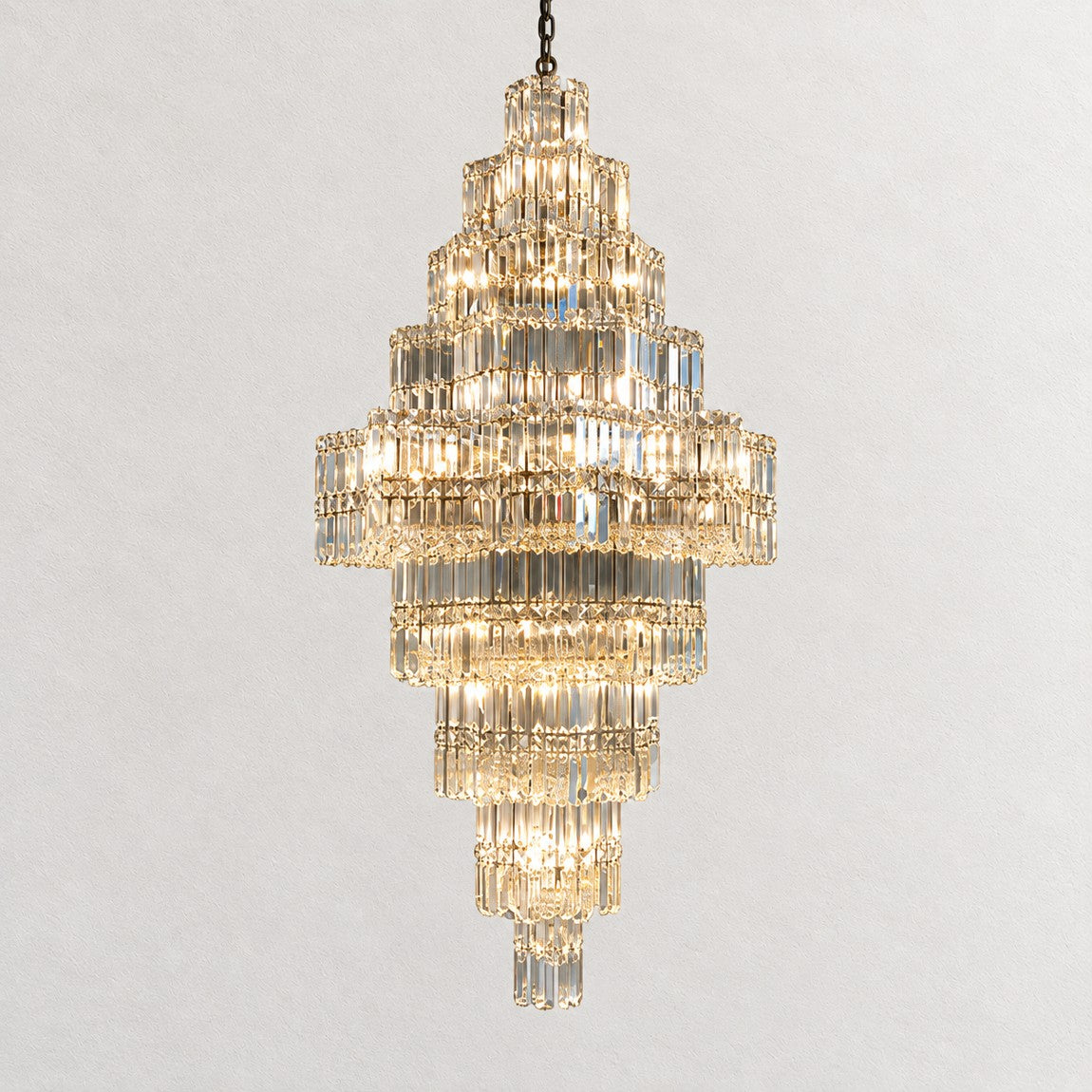 Universo Crystal Halo Chandelier on a light warm plaster wall