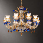 Vibrena Blue Amber Glass 10-Light Chandelier 49.2" on a dark olive wall